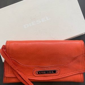 Diesel leather clutch. Orange for attention. Lots of slots and zippers pockets.